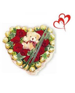 12 red roses in a heart shaped cane basket along with embedded teddy and 16 pieces of ferrero rocher chocolates